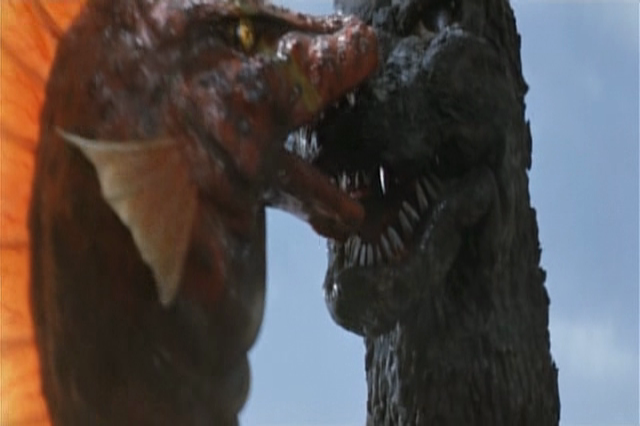 File:Titanosaurus nomming on Godzilla's FACE.png