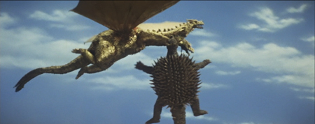 File:SoshingekiAngira Anguirus bites ShodaiGhido King Ghidorah in Destroy All Monsters DAM 2.jpeg