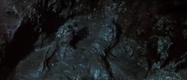 File:Hedorah tries to smother Godzilla in slime.png