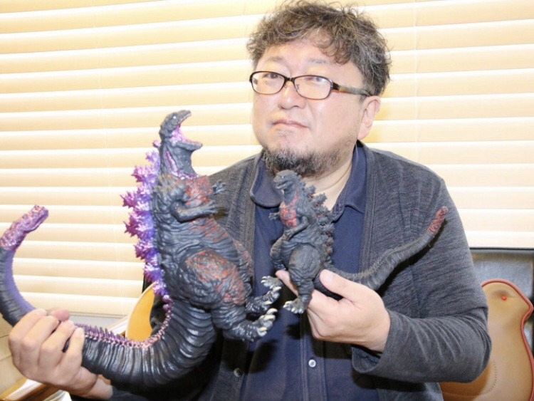 File:Shinji Higuchi holding godzilla figures.jpg