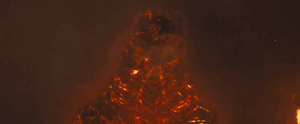 File:Burning Godzilla incinerates Ghidorah.gif
