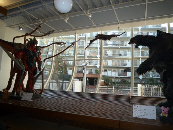 File:Gamera and Iris Suits in Cafe.jpg