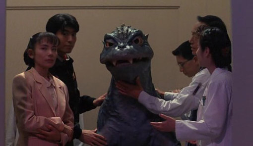 File:Baby Godzilla with human friends.jpg