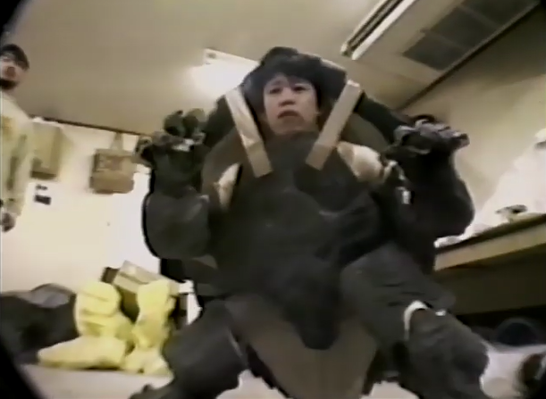 File:GGOTU - Jun Suzuki tries on WIP Gamera suit.png