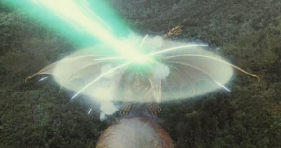 File:Grand King Ghidorah's force barrier repelling Mothra's Mineral Chest Beam.jpg