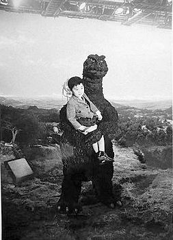 File:DAM - Godzilla holds some kid.jpg