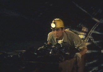 File:Rodan 1956 - Shigeru riding on the mine cart.jpg