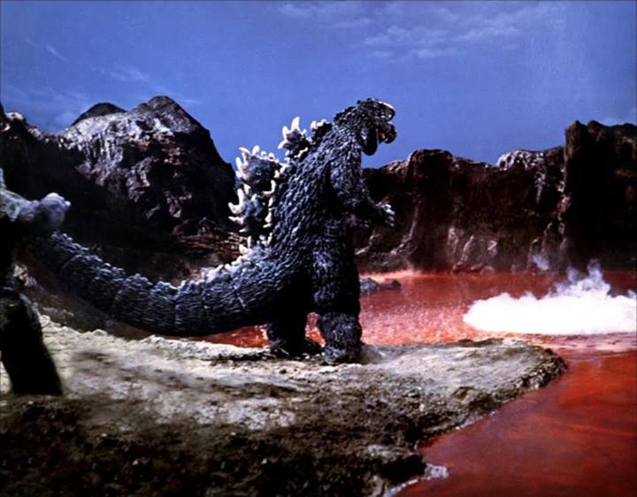 File:Son Of Godzilla - Godzilla Stands In Front Of A Red Lake.jpg